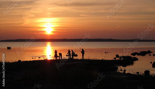 sunset on the beach with people © JanBS-Foto