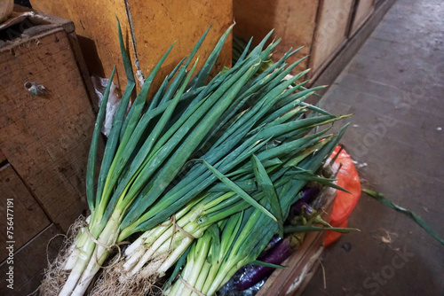 Raw green organic leeks at the traditional market