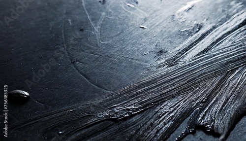 black surface with dust and oily fingerprints full frame close up background photo