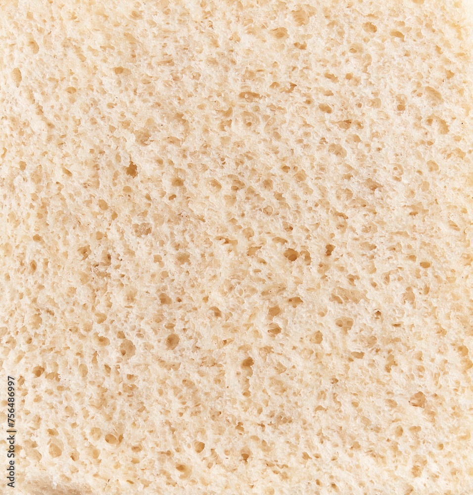 Close-up texture of a piece of white bread, emphasizing its porous surface and airy crumb for culinary contexts.