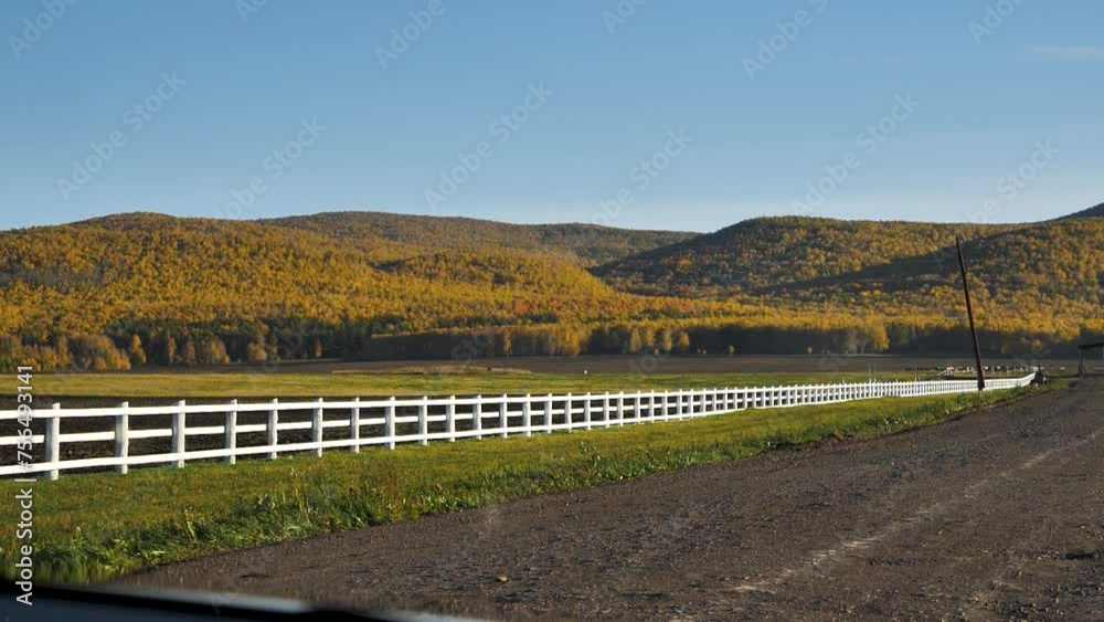 View from the tractor cabin to autumn arable land, farmland, mountains in autumn