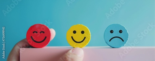 Customer satisfaction survey in action with a hand selecting the happy face option demonstrating a high approval rating