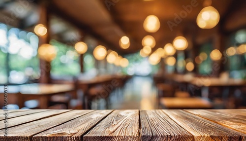 close up of an empty wooden table and blurred bokeh background restaurant mockup background for product display