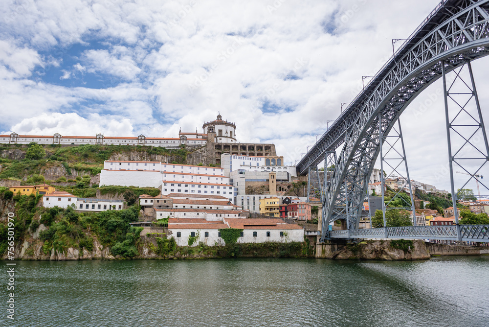 Dom Luis I Bridge over Douro River between cities of Porto and Vila Nova de Gaia, Portugal. VIew with Monastery of Serra do Pillar