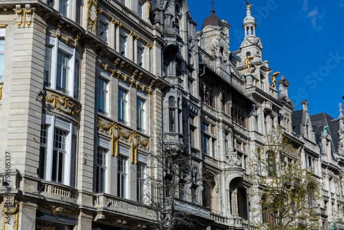 Antwerp, Belgium. 15 April 2023. Facades of Antwerp, old historical buildings in the centre of the city. Decorated with golden statues at Grote Markt of Antwerp