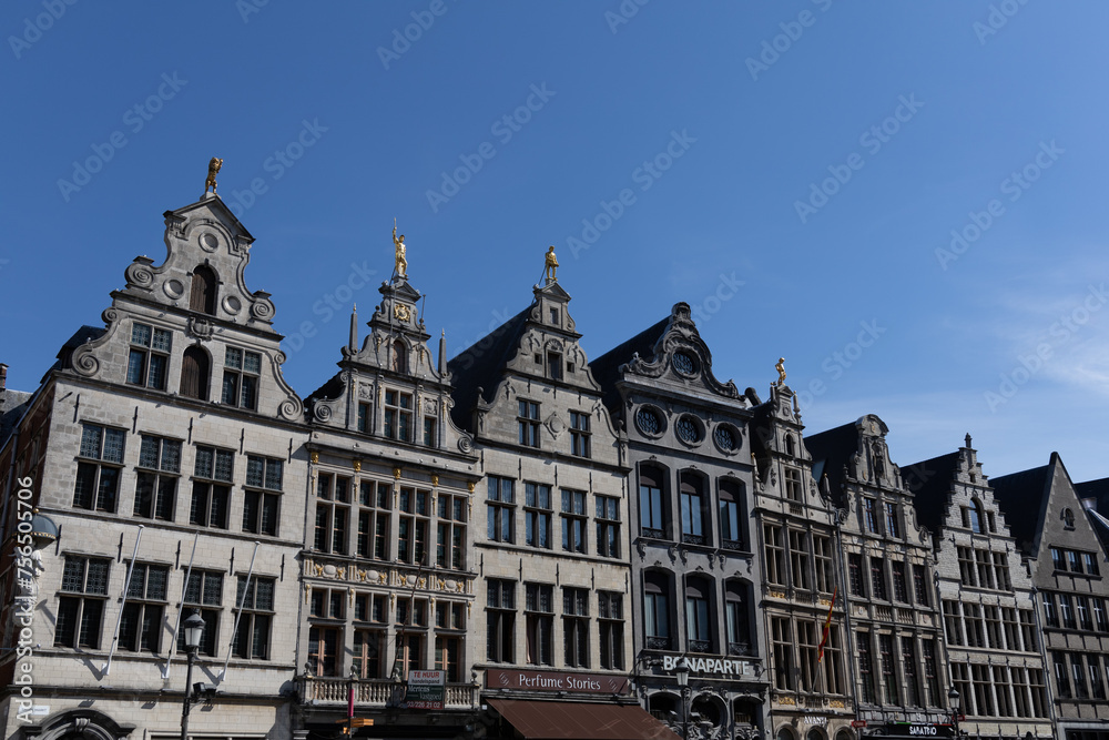 Antwerp, Belgium. 15 April 2023. Facades of Antwerp, old historical buildings in the centre of the city. Decorated with golden statues at Grote Markt of Antwerp