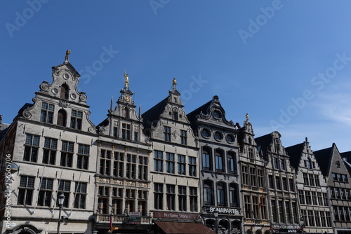 Antwerp, Belgium. 15 April 2023. Facades of Antwerp, old historical buildings in the centre of the city. Decorated with golden statues at Grote Markt of Antwerp