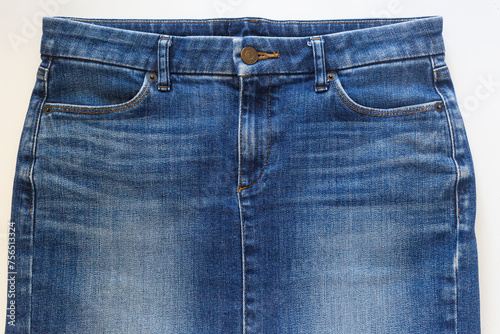 Blue jean skirt in front view on white background, closed-up studio shot.