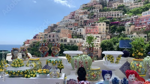 Positano, tourist destination on the Amalfi Coast, Italy. Aerial view of Colorful houses on a Tyrrhenian sea coast seen through green juicy flora in Positano 