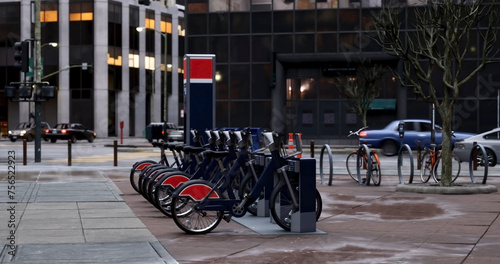 Generic Electric bicycle charging station. Shared electric bikes parked for rent on city street