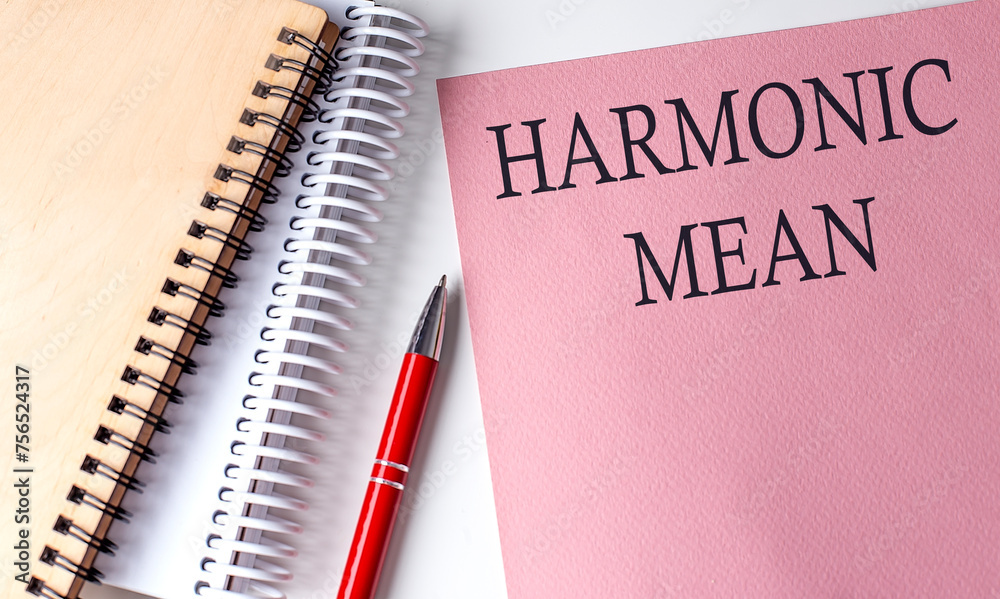 HARMONIC MEAN text on pink paper with notebook