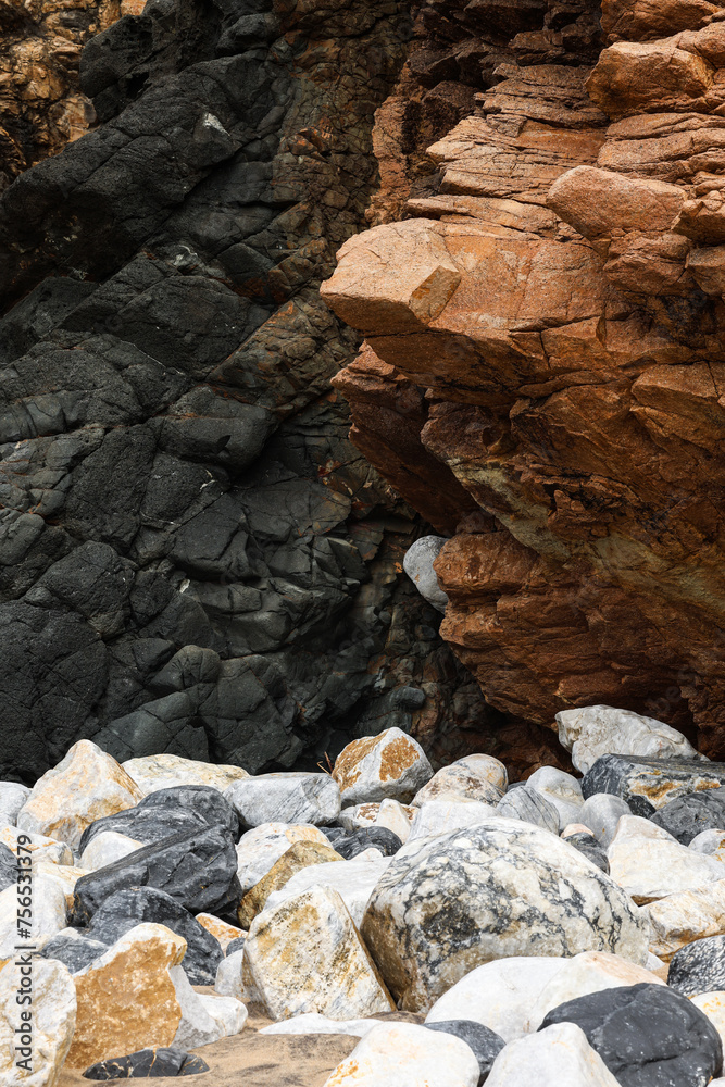 Rocks background texture photo. White brown and black stones from a mountain.