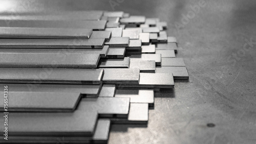 Stack of stainless steel flat bar of background. 