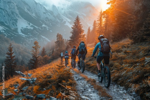 A group of bikers on a trail in a scenic autumn forest with sun peering through pine trees, conveying adventure and exploration