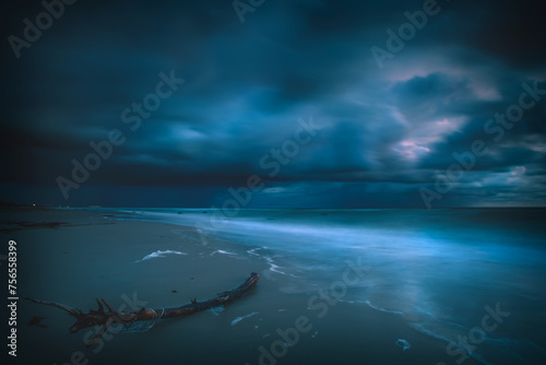 Storm clouds approaching a Baltic Sea beach in evening, Lithuania photo