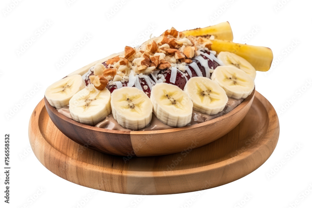 Acai bowl served in a wooden bowl Including peanut butter, banana and granola, sprinkled with coconut flakes. placed on a cutting board Isolated on a clear background. Acai bowl served in a wooden bowl Including peanut butter, banana and granola, sprinkled with coconut flakes. placed on a cutting board Isolated on a clear background.