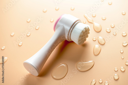 Brush for washing and cleaning the face with drops of water. Hygienic device. Female beauty.