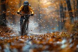 A mountain biker surrounded by vibrant fall colors speeds through a forest trail, kicking up leaves