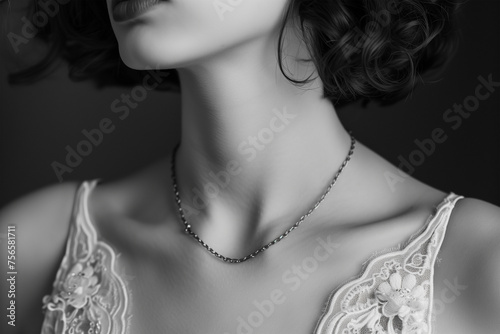 Woman wearing delicate chain necklace. Beauty concept. photo