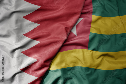 big waving national colorful flag of togo and national flag of bahrain.