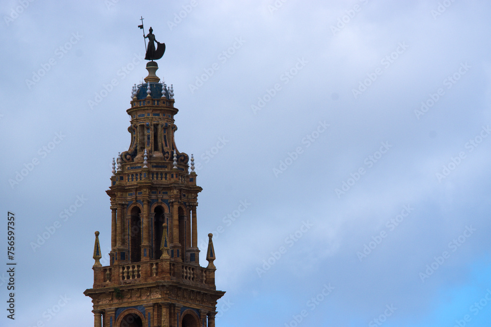 The tower of Saint Peter's church against the sky, in Carmona
