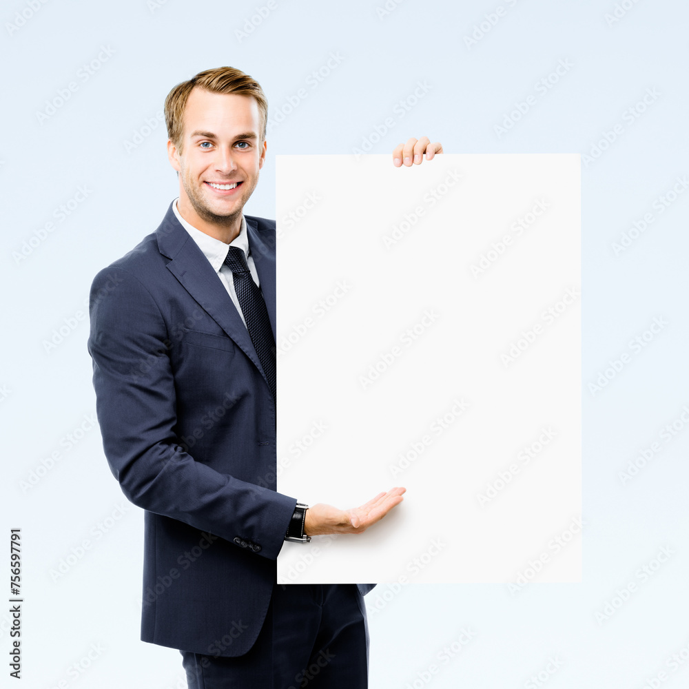 Image of business man showing advertise mock up sign board, empty banner with copy space area for ad slogan text, isolated grey background. Businessman hold blank white paper signboard. Image of business man showing advertise mock up sign board, empty banner with copy space area for ad slogan text, isolated grey background. Businessman hold blank white paper signboard.
