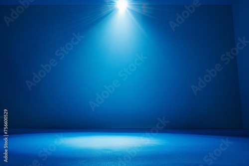 plain blue background with studio light above in star shape