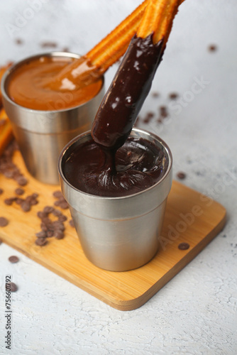 Wooden Tray With Two Cups of Dipping Sauce