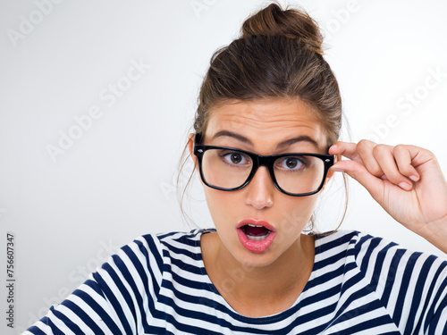 Confused  woman and portrait with surprise in studio  white background and mockup with questions. Doubt  why and student with glasses and emoji of anxiety for feedback or information with stress