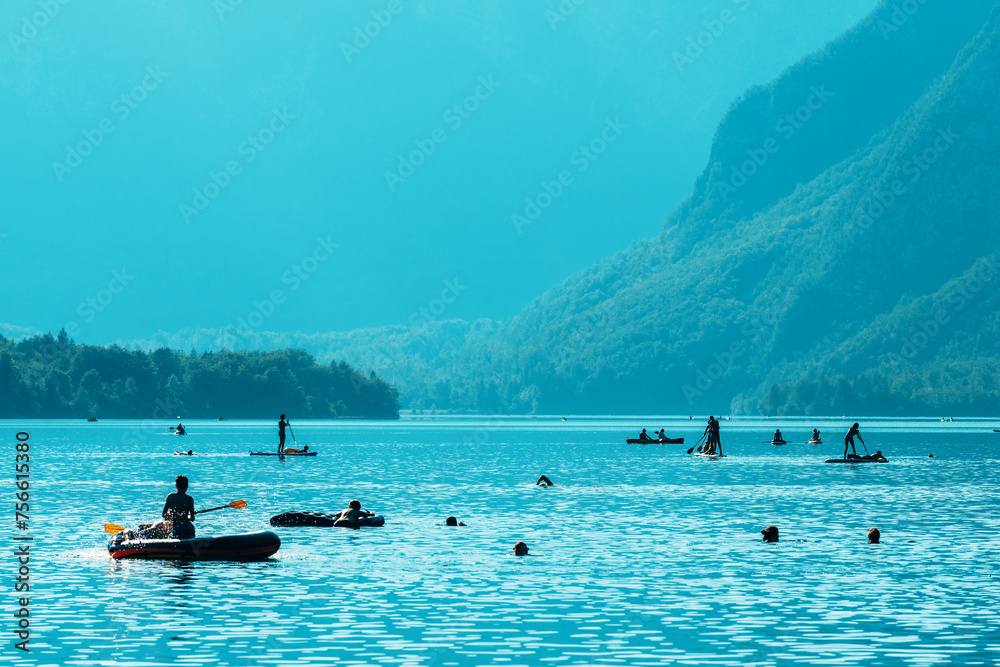 Fototapeta premium People enjoying water activities at lake Bohinj in Slovenia, summer season outdoor sports