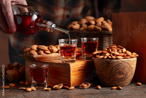 Italian liqueur Amaretto with almonds nuts. © Igor Normann