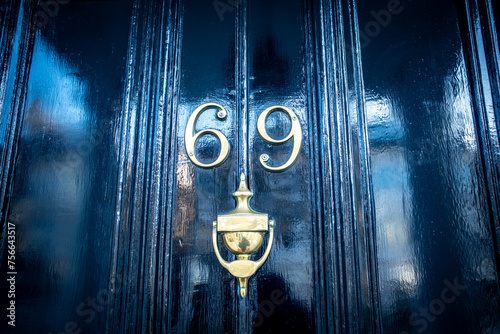 House number 69- residential building number photo