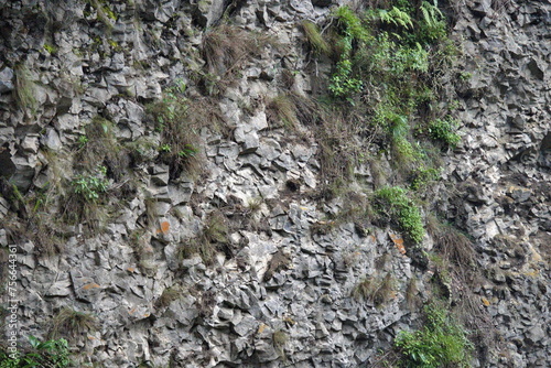Rocky cliff face at the Pailon del Diablo waterfall in Banos, Ecuador