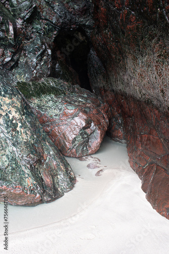The metamorphic rock serpentine in a sea cave at Kynance Cove Cornwall photo