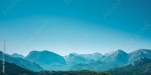 Praising the rugged beauty of mountains under a clear blue sky. Concept Mountains, Rugged Beauty, Blue Sky, Nature Photography