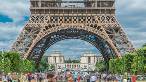 Champ de Mars and the Eiffel Tower timelapse in a sunny summer day. Paris, France photo