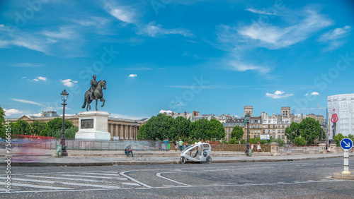 The equestrian statue of Henry IV by Pont Neuf timelapse, Paris, France. photo