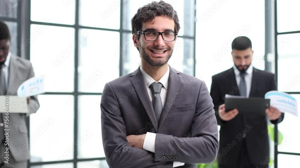 Young Confident Businessman Smiling at the Camera Young Confident Businessman Smiling at the Camera