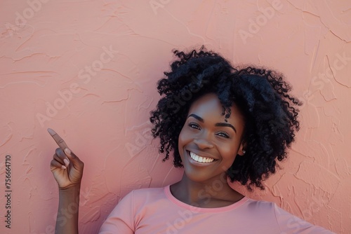 Happy African American woman gesturing upwards with a smile