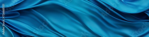 Turquoise panoramic silk background, fabric with blurred satin wavy texture.