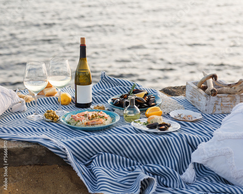 Fototapeta Naklejka Na Ścianę i Meble -  Shrimp, Seafoods, appetizers and salads on the table in Fish Restaurant. Beach Restaurant in Greece or Turkey. Aegean seaside, Greek or Turkish style fish restaurant in Bodrum, Santorini or Mykonos