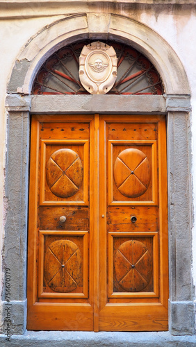 Ancient and magnificent solid wooden door to the town of Bonifacio, a superb town in southern Corsica (nicknamed the island of beauty), famous for its marina, its gigantic cliffs and its citadel