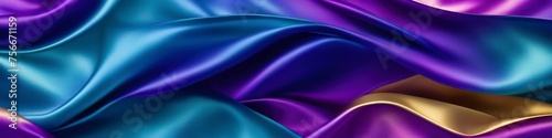 Multicolored panoramic silk background, fabric in bright turquoise, purple and gold tones with blurred satin wavy texture.
