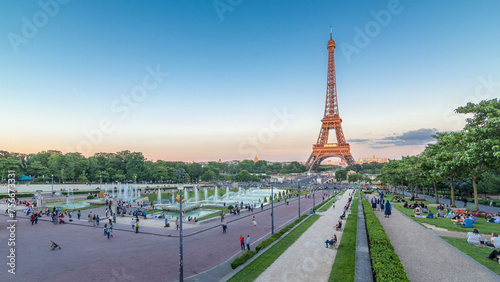 Sunset view of Eiffel Tower timelapse with fountain in Jardins du Trocadero in Paris, France.