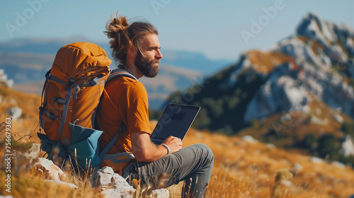 digital nomad, a bearded man with a backpack sitting on a hillside with a laptop
