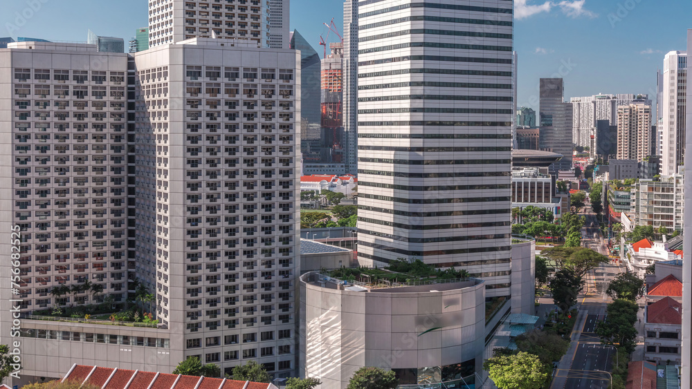 Obraz premium A beautiful morning panorama with Marina Bay area and skyscrapers city skyline aerial timelapse.