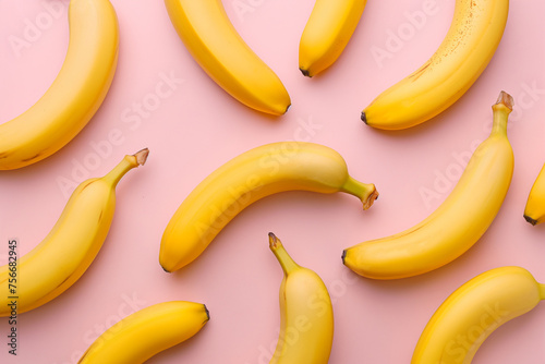 Pattern with bananas, top view, flat lay. Tropical abstract background. Banana on yellow background. Colorful fruit pattern, healthy eating, vegan, vitamins, super food concept, raw food
