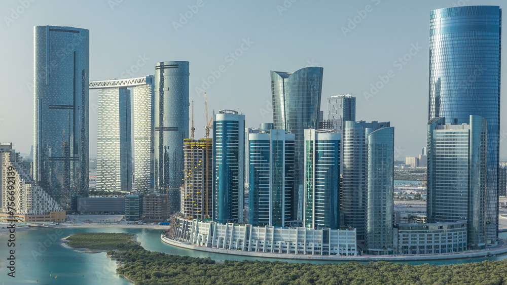 Obraz premium Buildings on Al Reem island in Abu Dhabi timelapse from above.