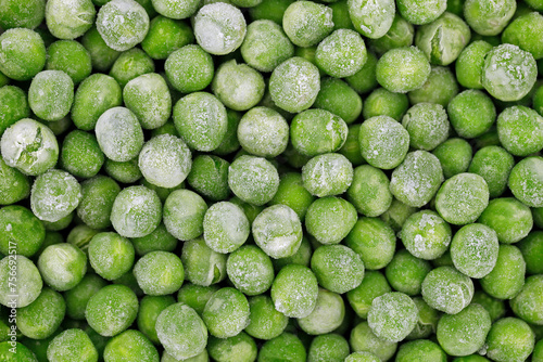 close up of frozen green peas, top view of vegetable food, peas from freezer background