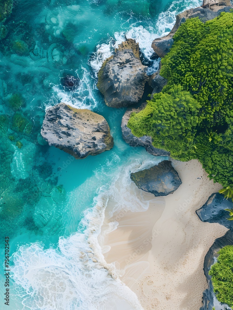 Aerial shot capturing Bali's stunning beach, with its turquoise waters, pristine white sands, and vibrant greenery, epitomizing tropical paradise.